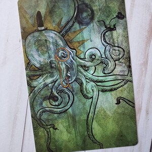 May include: A green and blue illustration of an octopus wearing a top hat and monocle. The octopus has eight tentacles and is surrounded by a starburst.