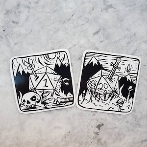 May include: Two black and white stickers featuring a 20-sided die and a 4-sided die. The 20-sided die is on fire and has a sword sticking out of it. The 4-sided die is surrounded by bones and a skull. Both stickers have a mountain range in the background.