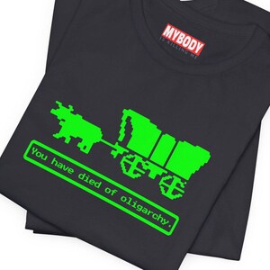 You Have Died of Oligarchy Oregon Trail TShirts Parody TShirts Funny Vintage Game Humorous Anti Trump Elon Musk Dark Grey Tees Green Bull and Wagon Resist