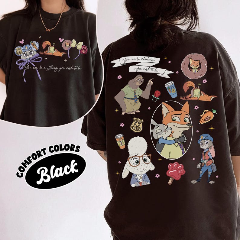 Puede incluir: Camiseta negra Comfort Colors con personajes de dibujos animados y el texto "You can be anything you wish to be." La parte trasera de la camiseta muestra varios personajes y el texto "You can be whatever, you wish to be."