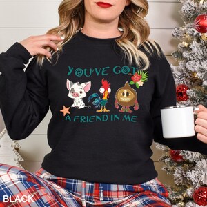 May include: Black sweatshirt with a graphic of characters from the movie Moana. The text on the sweatshirt reads "You've Got A Friend In Me".
