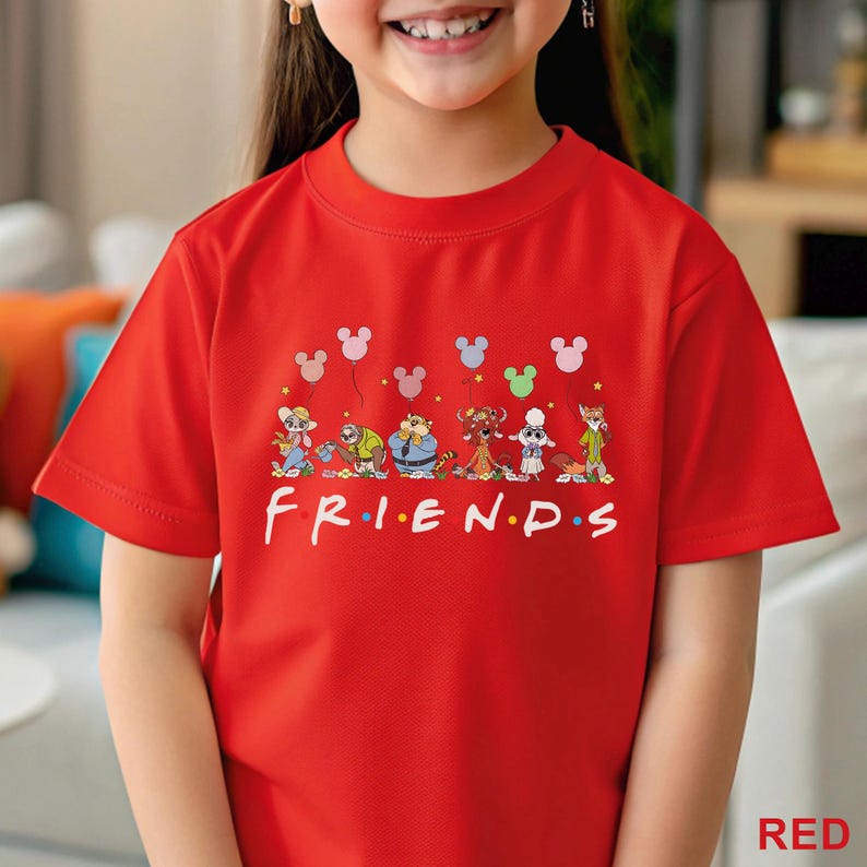 May include: A red t-shirt with the word "FRIENDS" in white, and cartoon characters with Mickey Mouse-shaped balloons above. The shirt has short sleeves and a round neck.