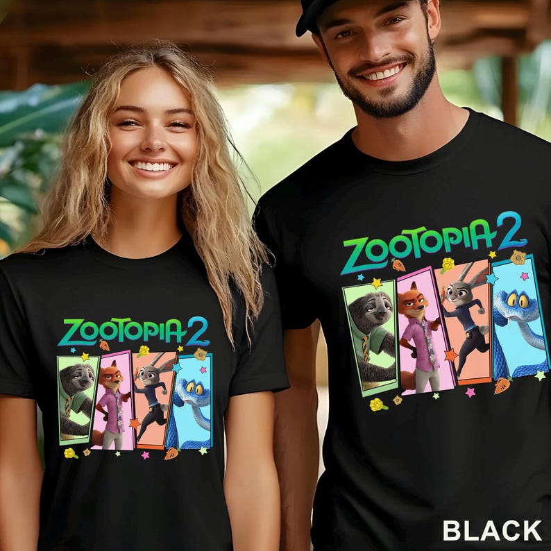 May include: Black t-shirts with the text "Zootopia 2" in green and blue, and cartoon character graphics. The shirts are worn by two people. The word "BLACK" is printed at the bottom of the image.