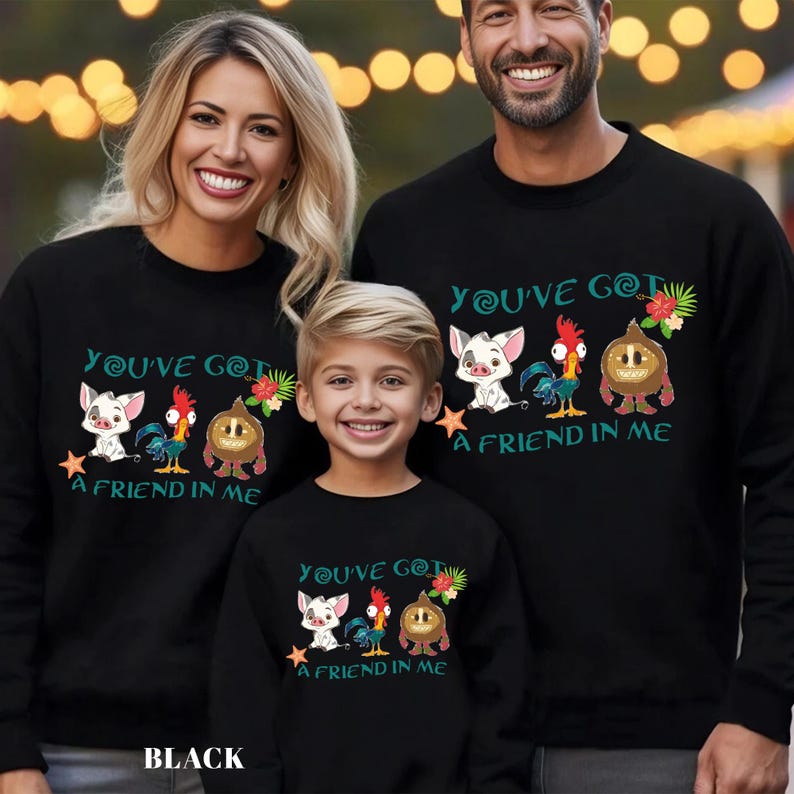 May include: A family matching set of black sweatshirts with a graphic print of characters from the Disney movie Moana. The text on the sweatshirts reads "You've got a friend in me".