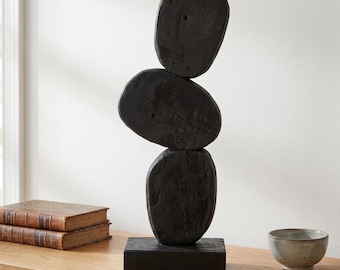 Decorative sculpture in stacked black wood, minimalist Wabi-Sabi style art object, organic interior decoration, handmade wooden totem