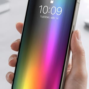 May include: A smartphone with a metallic frame and a vibrant, vertical gradient screen display showing the time 10:09, Tuesday, May 14, a lock icon, and the text Swipe up to open. The screen features a spectrum of colors including yellow, orange, pink, and blue.