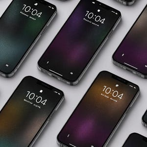 May include: A collection of smartphones with black screens displaying the time 10:04. The screens have gradient backgrounds in various colors, including green, purple, and gold. The phones are arranged on a light gray surface.