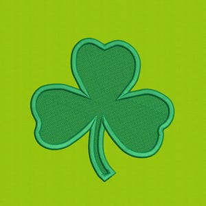 May include: A green embroidered shamrock with three heart-shaped leaves and a stem, set against a lime green background. The shamrock is a symbol of luck and is often associated with St. Patrick's Day.