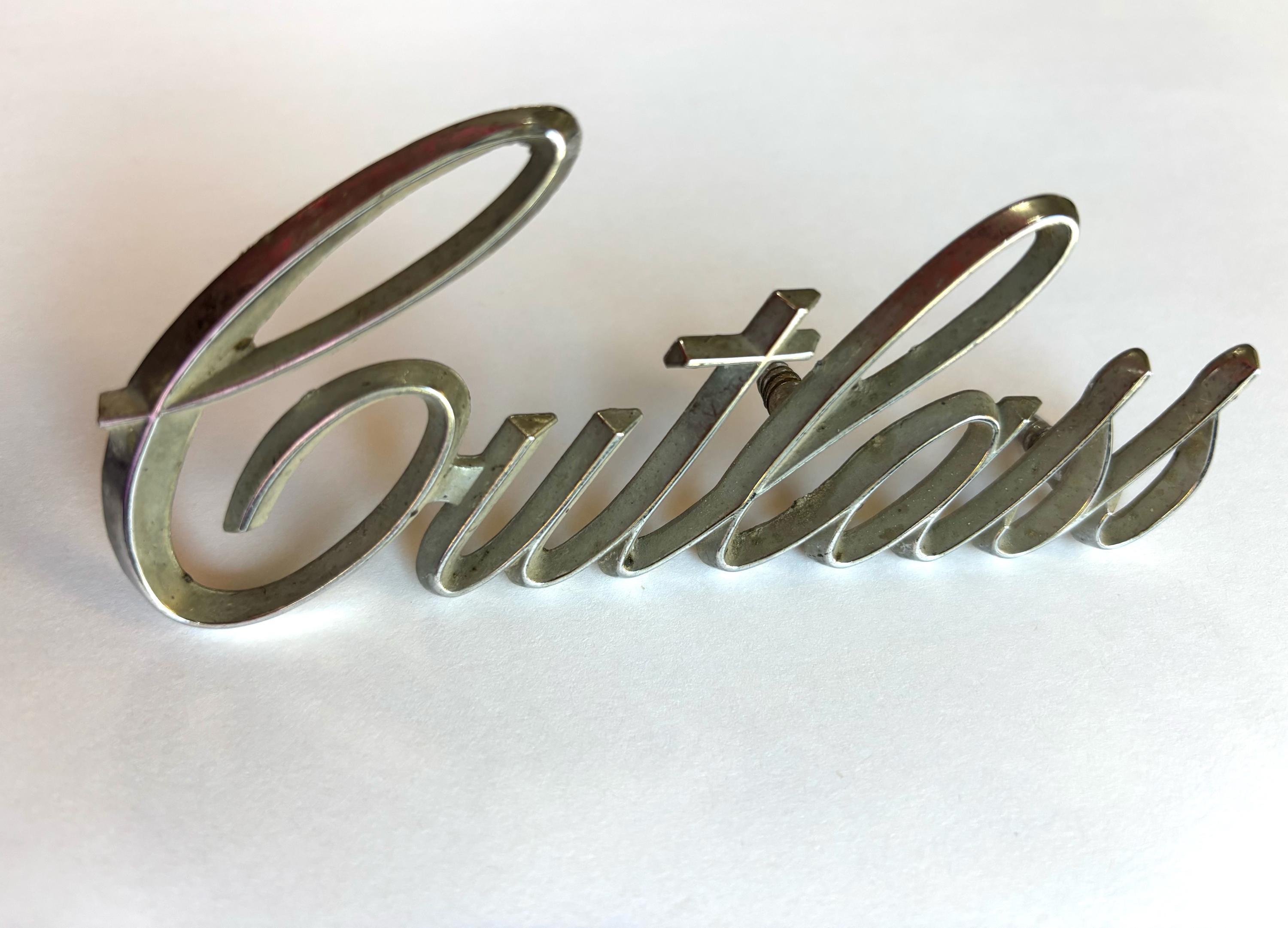 1970 Oldsmobile Cutlass Fender Emblem - New Script Badge (EM2452T) For Restoration