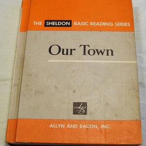 May include: A vintage orange and gray paperback book titled "Our Town" from The Sheldon Basic Reading Series. The book is published by Allyn and Bacon, Inc.