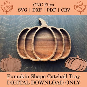 May include: A wooden pumpkin-shaped catchall tray with a carved design. The tray has a large pumpkin shape with four interior sections. The image also includes two smaller pumpkin cutouts and text that reads "CNC Files SVG | DXF | PDF | CRV" and "Pumpkin Shape Catchall Tray DIGITAL DOWNLOAD ONLY."