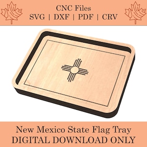 May include: A wooden tray with a black border, featuring the New Mexico state flag design. The flag design is a stylized sun symbol with radiating lines, representing the Zia sun symbol. The tray is a digital download file for CNC cutting.