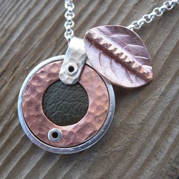 Small Round Sterling and Copper Pendant Inset with Green Leather Including a Copper Leaf