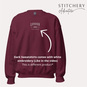 May include: Burgundy sweatshirt with white embroidery that says "LONDON EST 1948 UNITED KINGDOM" with a small embroidered Union Jack flag. The text "Dark Sweatshirts comes with white embroidery (Like in the video) This is different product*" is below the image.