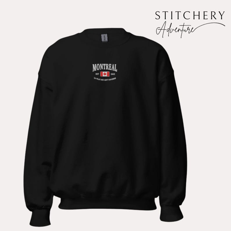 May include: Black sweatshirt with the word "MONTREAL" in white, above a Canadian flag graphic. The text "EST 1642" and a French phrase are below the flag. The brand name "STITCHERY Adventure" is in the upper right corner.