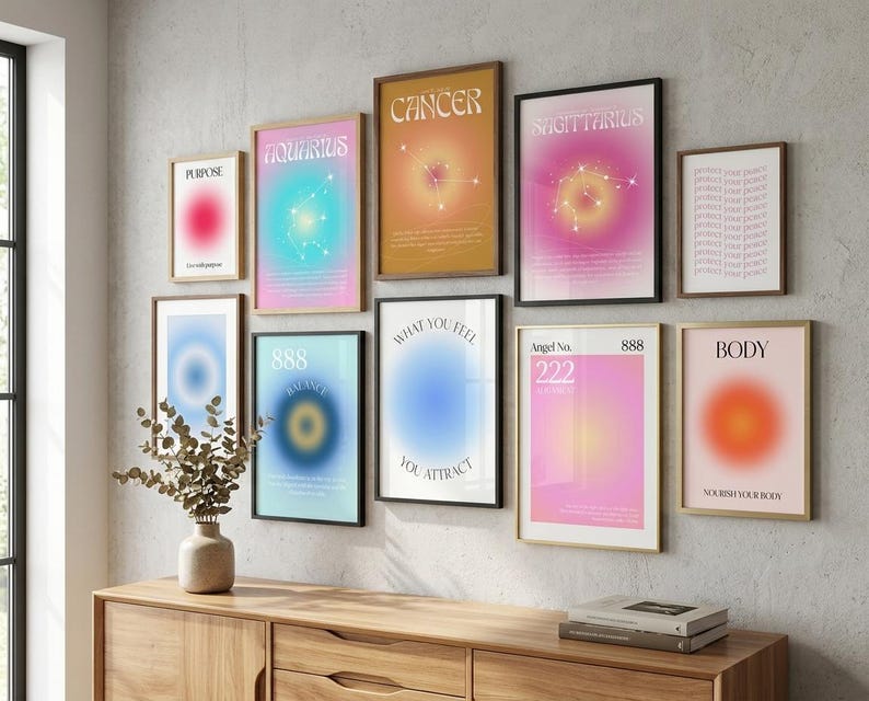 May include: A gallery wall arrangement of ten framed posters featuring gradient aura designs, zodiac constellations, and motivational text including Purpose, Aquarius, Cancer, Sagittarius, 888 Balance, What You Feel You Attract, Angel No. 222, and Body.