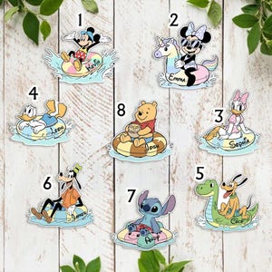 May include: A collection of eight die-cut stickers featuring Disney characters on pool floats, numbered one through eight. Characters include Mickey, Minnie, Donald, Daisy, Pluto, Goofy, Winnie the Pooh, and Stitch, each with a personalized name.