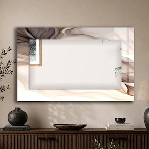 May include: A rectangular wall mirror featuring a wide border with a flowing, abstract marble-like pattern in shades of cream, beige, and dark brown. The central reflective surface is clear and rectangular, framed by the decorative, fluid-patterned border.