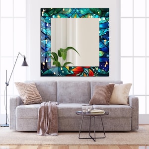 May include: A square mirror with a colorful stained glass frame featuring blue, green, and red floral designs. The frame has a textured, swirling pattern with white accents.