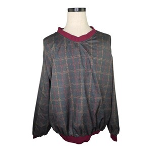 May include: A vintage pullover windbreaker with a plaid pattern in shades of gray, brown, and burgundy. The windbreaker has a V-neck collar and cuffs in a solid burgundy color. The bottom hem is also burgundy.