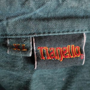 May include: A set of three ceramic mugs with a speckled, matte finish. Each mug features a different color: light blue, cream, and gray. The mugs have a simple, modern design with a rounded shape and a comfortable handle.