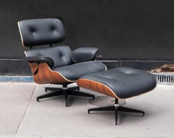 Poltrona lounge premium in stile Eames con poggiapiedi – Pelle nera e legno di noce.