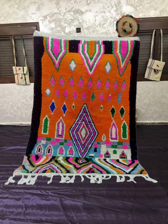 Moroccan Berber Rug: Handwoven Wool with Bold Orange Patterns