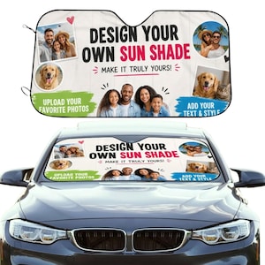 Peut inclure: Un pare-soleil de voiture personnalisé avec un fond blanc et le texte DESIGN YOUR OWN SUN SHADE MAKE IT TRULY YOURS. Le design comprend des emplacements pour des photos personnelles, un élément graphique vert et un élément bleu avec du texte.