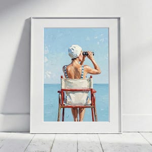 May include: A framed painting depicts a person in a white swim cap and striped swimsuit, seated in a director's chair, looking through binoculars. The background features a blue sky and ocean, evoking a beach scene.