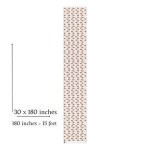 May include: A long, rectangular table runner with a repeating pattern of brown and pink floral designs. The runner measures 30 x 180 inches, or 15 feet in length. The background is a light pink color.