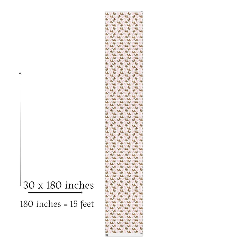 May include: A long, rectangular table runner with a repeating pattern of brown and pink floral designs. The runner measures 30 x 180 inches, or 15 feet in length. The background is a light pink color.