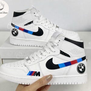 May include: A set of three ceramic mugs with a speckled, matte finish. The mugs are in shades of cream, light gray, and dark gray. Each mug has a simple, minimalist design, perfect for coffee or tea.