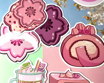 May include: A collection of stickers featuring illustrations of cherry blossoms, a pink swiss roll cake, a bubble tea drink, and a pink cake. The stickers have a cute, cartoonish style with pink and green color schemes. The stickers have the text "MelRoses Art".