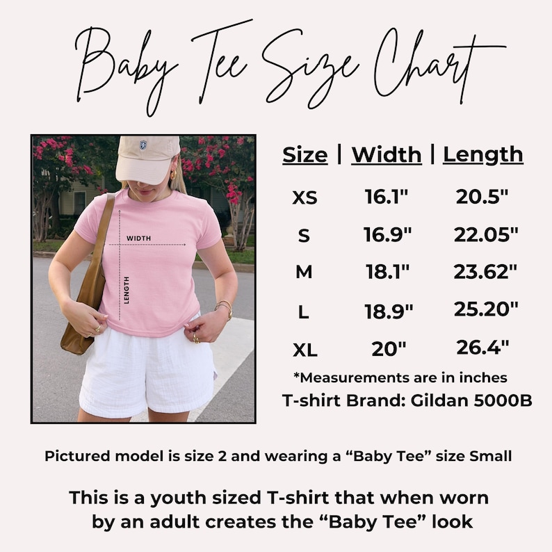 May include: A pink baby tee size chart with measurements in inches. The chart includes sizes XS to XL, with width and length measurements. The model is wearing a size small. The shirt is a youth size that creates a baby tee look.