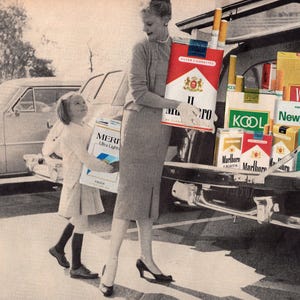 May include: Vintage black and white image of a woman and child carrying large boxes of cigarettes. The woman holds a box of "Marlboro" cigarettes, while the child carries a box of "Meri" cigarettes. Other cigarette brands are visible in the car trunk.