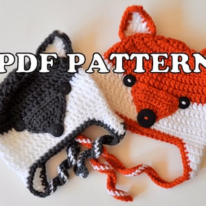 Puede incluir: Dos gorros de animales de ganchillo, uno gris y blanco con botones negros y otro naranja y blanco con botones negros. Los gorros tienen orejas y lazos. El texto "PDF PATTERN" se muestra en la imagen.