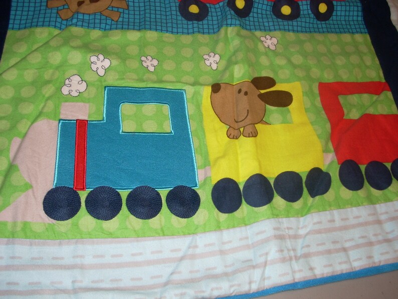 by 34 inches wide 40 inches long Firetruck and Train cotton front and blue fleece backing small size Blanket Puppy in Truck