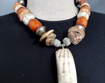 Artisan vintage African trade beads necklace with a Yoruba Arca shell "Hippo tooth" pendant.  Tribalgallery