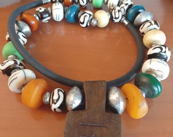 Moroccan Berber beads necklace, batik bone beads, silver metal beads, camel bone beads and a wooden cattle amulet. tribalgallery.