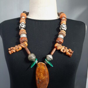 Vintage African bone, horn, metal, glass, agate, clay and wood bead pendant necklace. tribalgallery
