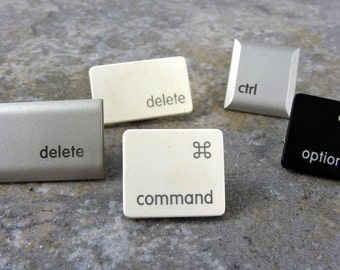 Chinchetas con forma de tecla de computadora