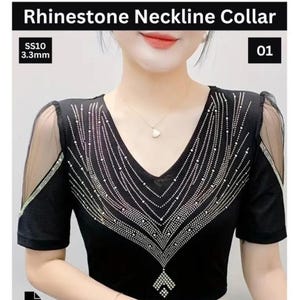 May include: Black V-neck top with rhinestone neckline collar. The short-sleeved shirt features a decorative rhinestone design and sheer mesh sleeves. The text "Rhinestone Neckline Collar" is at the top.