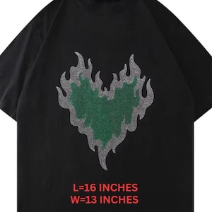 May include: Black t-shirt featuring a green heart design outlined with silver rhinestones, with flames. The shirt's dimensions are 16 inches long and 13 inches wide. The image also includes the text "Digital Files" and file type icons.