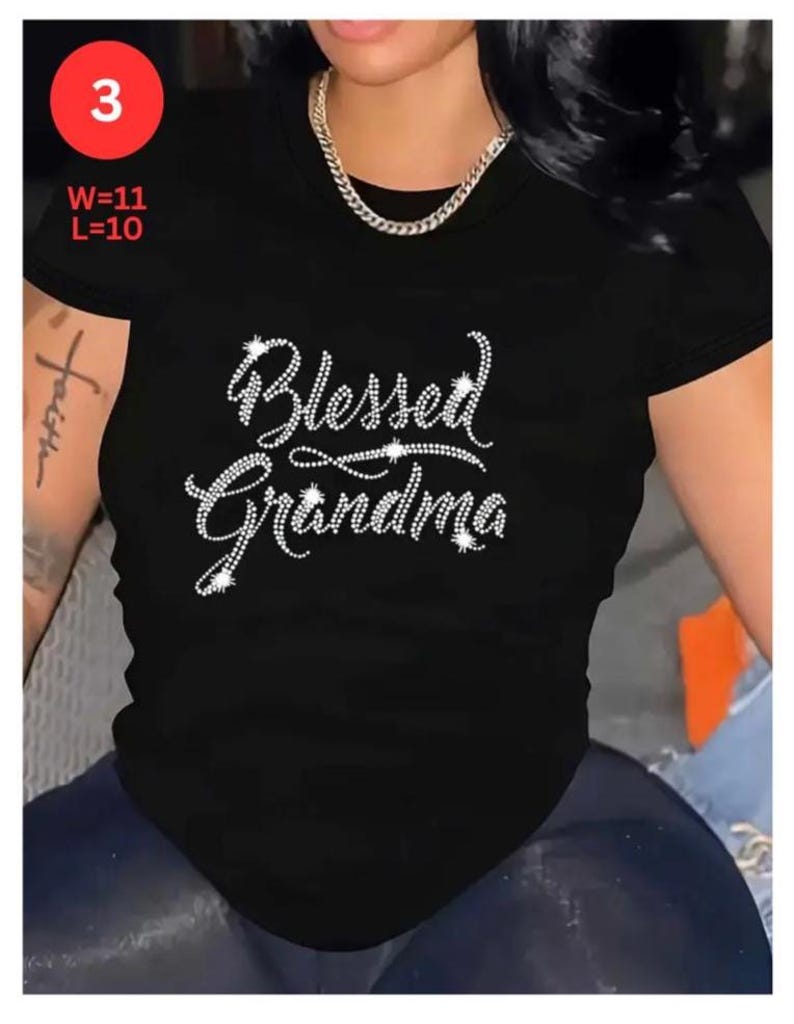 May include: Black t-shirt with the text "Blessed Grandma" in a rhinestone design. The shirt has a round neck and short sleeves. The image also includes the measurements W=11 and L=10.