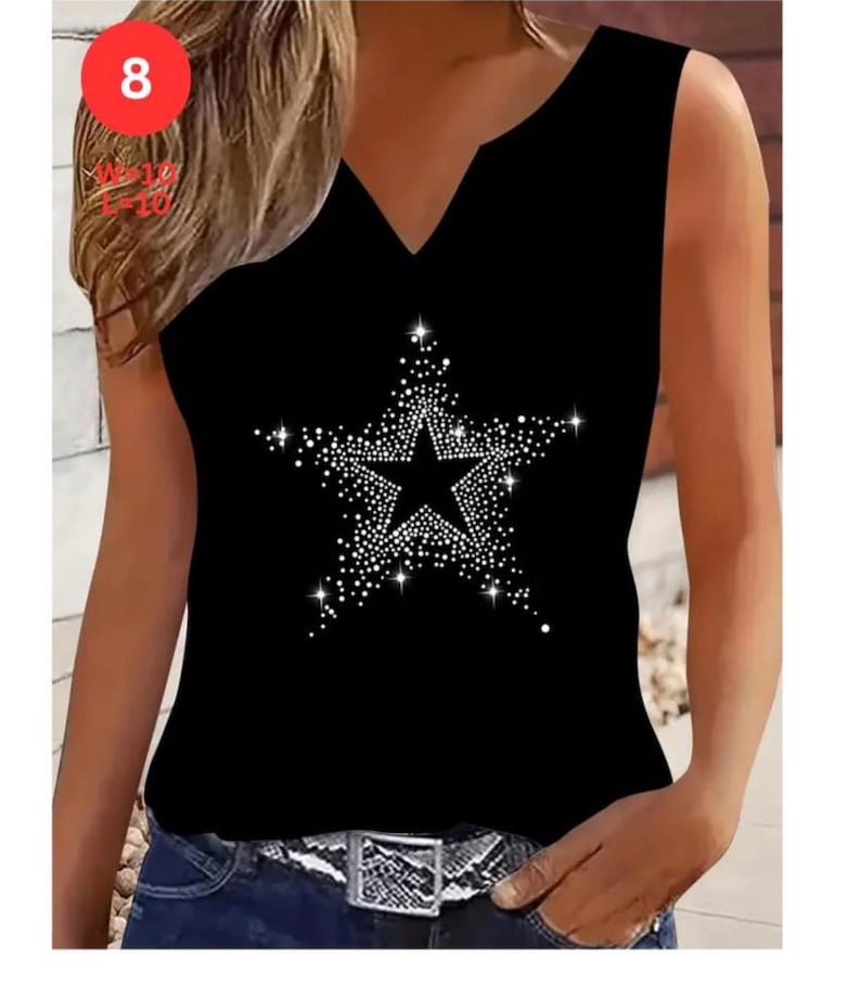 May include: Black sleeveless top with a V-neck and a large star design made of white rhinestones. The top is paired with blue jeans and a silver and black belt. The number 8 is visible in a red circle in the upper left corner.