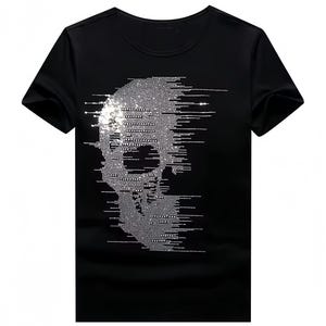 May include: Black crew neck t-shirt with a skull design made of small, shimmering silver elements. The skull graphic has a pixelated, glitch-like effect. The shirt has short sleeves and a classic fit.