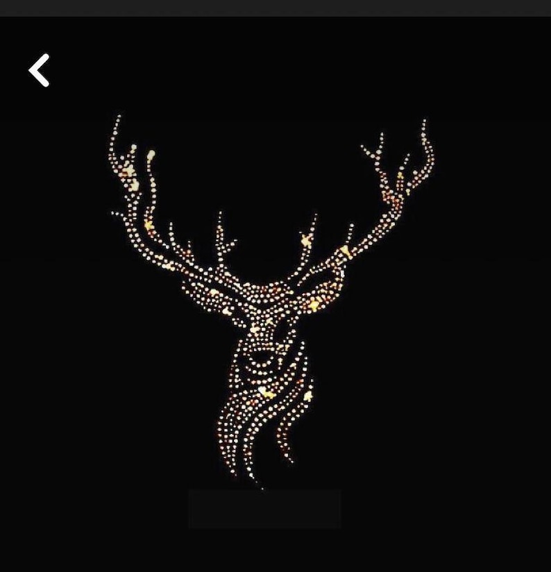 May include: A stag head silhouette composed of numerous small, glowing dots against a black background. The antlers are prominent, and the overall design is symmetrical. The dots create a sparkling effect, suggesting a festive or decorative item.