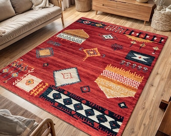 May include: A red, orange, and white patterned rug with geometric designs. The rug has a traditional Moroccan style.