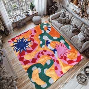 May include: A brightly coloured area rug with an abstract design. The rug features a mix of orange, red, pink, green, and blue shapes. The design includes sun-like figures and wavy patterns, adding a modern touch to the room's decor.