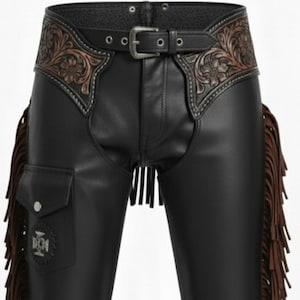 May include: Black leather chaps with brown fringe and decorative floral tooling on the belt. The chaps have a pocket on the left leg and a silver buckle. A classic western wear item.